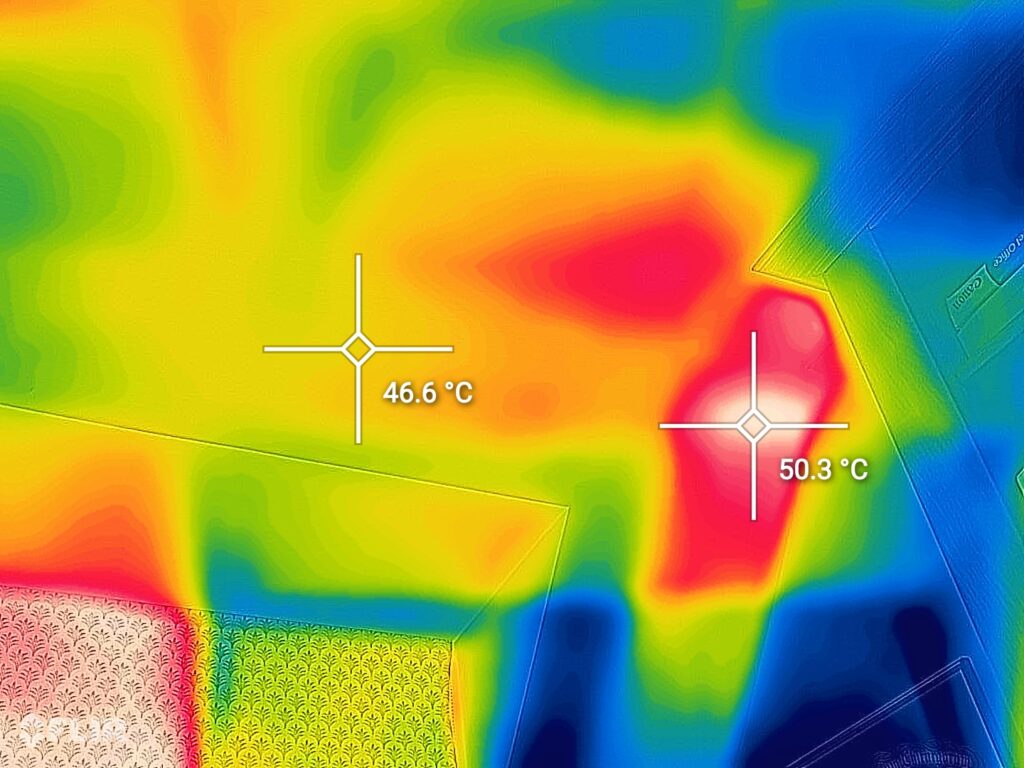 Thermal image showing over 50°C on the ceiling of an Oxfordshire home during a recent heatwave – a clear sign of an uninsulated loft trapping heat in the living space below.
